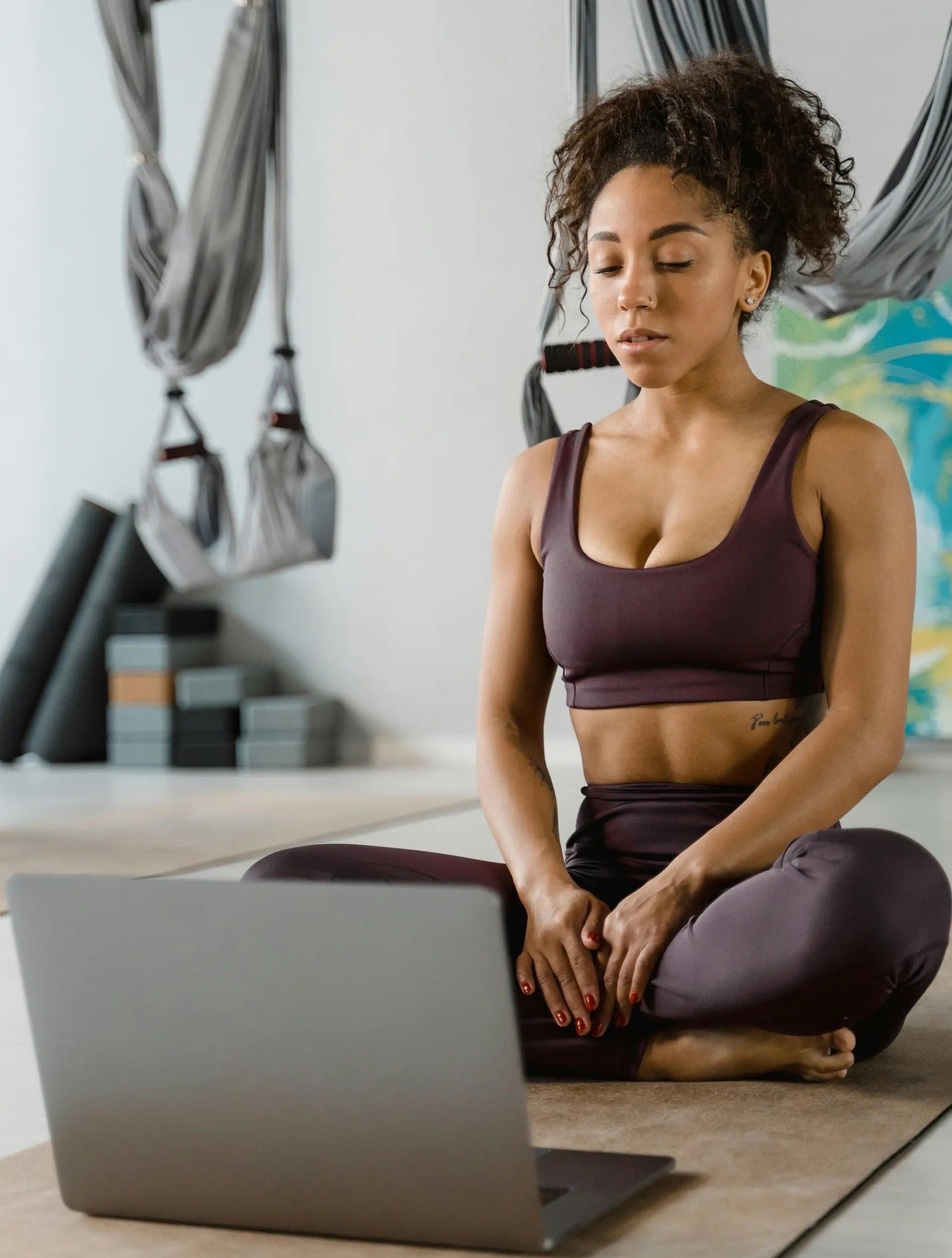 Yoga teacher with laptop